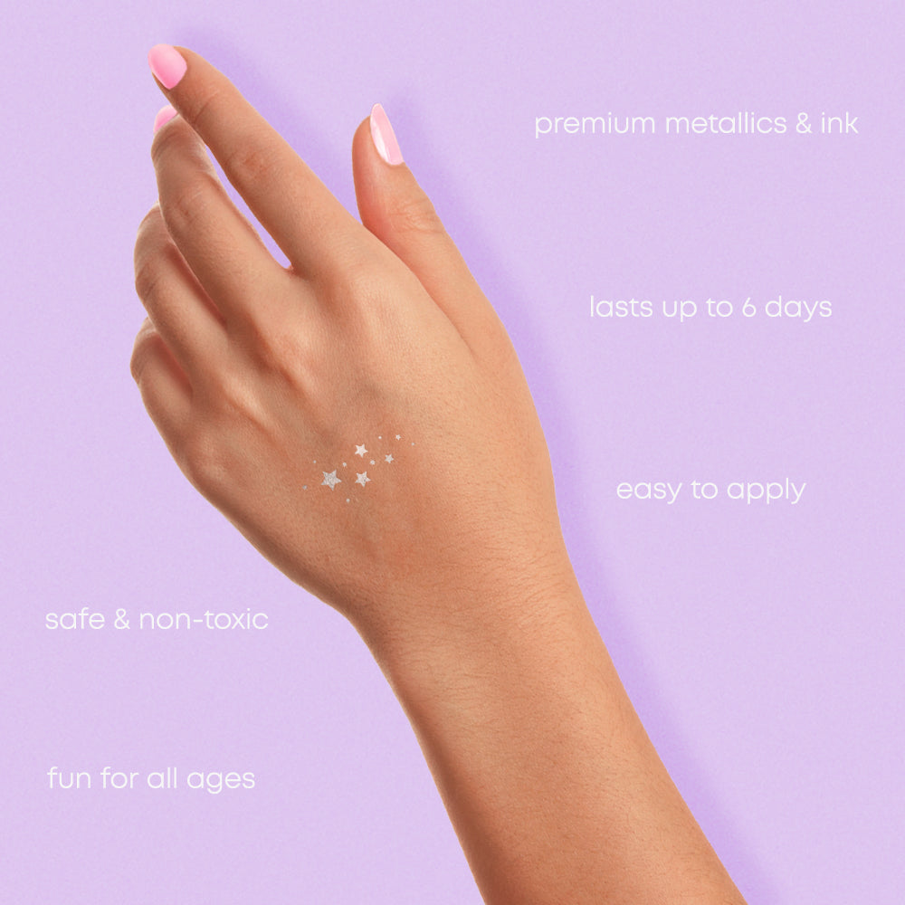 Silver star metallic temporary tattoos on a hand