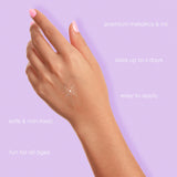 Silver shining star metallic temporary tattoo on a hand