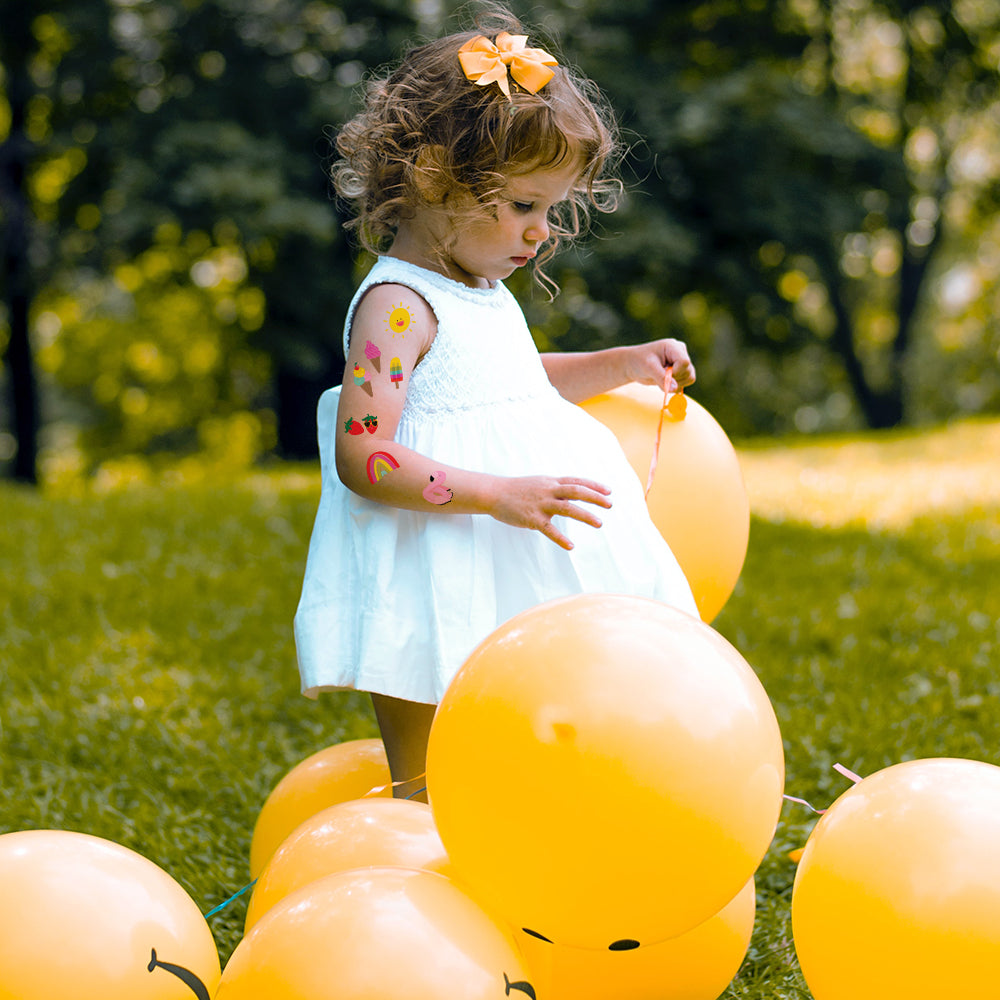 Summer Fun' kids temporary tattoo set includes five festive designs: rainbow, flamingo float, strawberries, popsicles and summer sunshine.