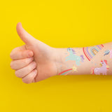 Sparkle in the festive and fun Enchanting Unicorns metallic kids temporary tattoos featuring shooting stars, unicorns and rainbow tattoos