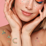 The Daisy Dreamer temporary tattoos pack features various freckles and designs featuring rainbows, smileys, daisies, stars, peace signs, bolts and flourishes for face and body. @FlashTattoos