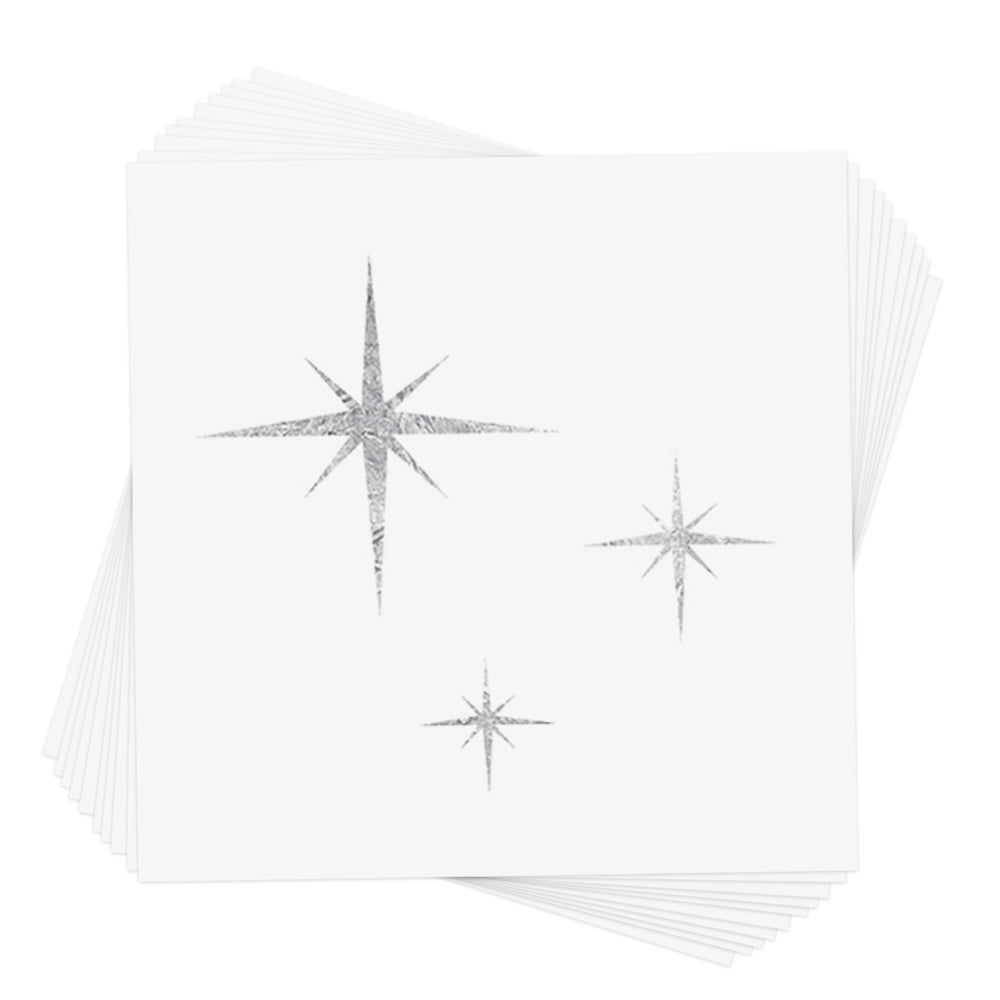 White card with metallic silver twinkle stars. 3 stars total in different sizes.