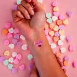 Sparkle and shine in the Happy Heart metallic temporary Valentine's Day tattoo