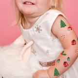 Merry and Bright Variety Set' featuring 25 assorted holiday inspired temporary tattoos: candy cane, Christmas tree, holly, presents, Santa
