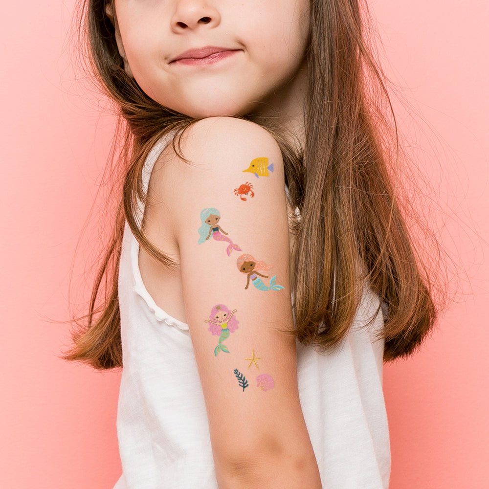 Mermaid Lagoon tattoo set features 25 assorted colorful little mermaid inspired kids metallic tattoos!