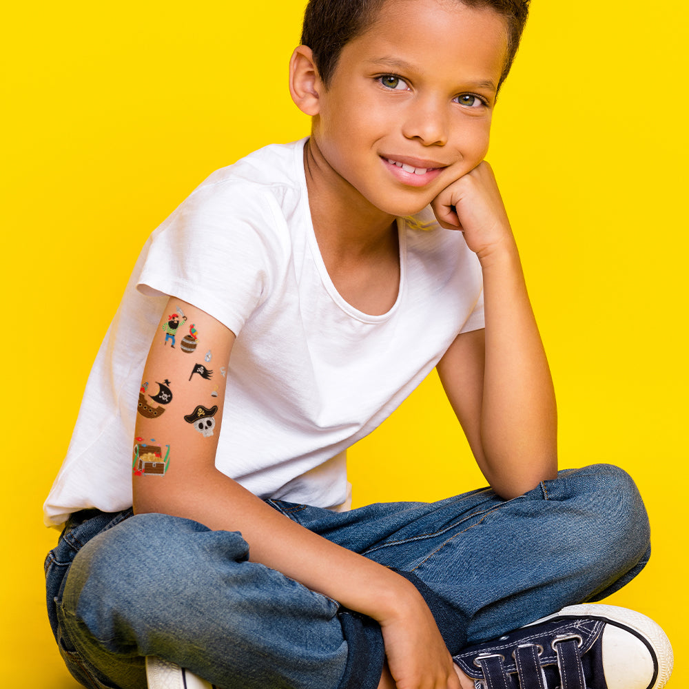 Flash Tattoos pirate tattoo variety set for kids includes 5 assorted designs: pirate, pirate ship, pirate skull, treasure chest, pirate flag