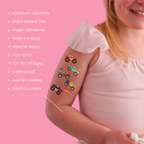 Child with temporary tattoos on arm against pink background, with product features listed.