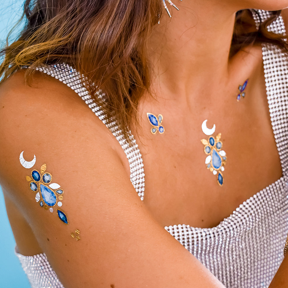 The mystical designs in the Aurora collection feature an enchanting array of gemstone and jewel temporary tattoos.