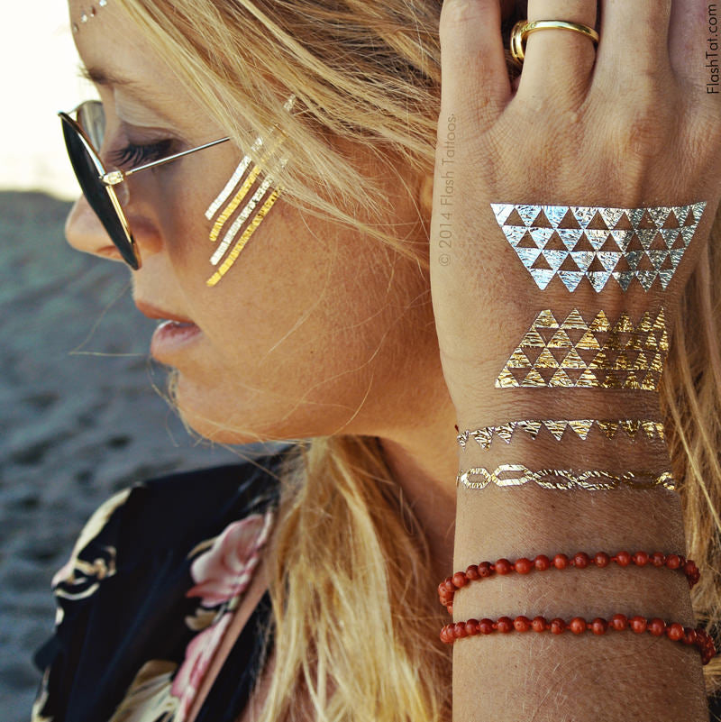 Add a touch of bling to your cheeks with modern geometric metallic line and triangle tattoos from the Dakota pack