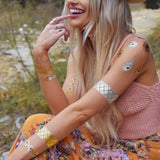 Sparkle in the Sofia collection featuring four sheets with over 32 exotic metallic tattoos designs: peacock feathers, silver bracelet, gold bracelet, boho bracelet
