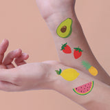 Tutti Frutti Variety Set featuring 25 assorted colorful temporary tattoos: lemon, strawberries, watermelon, pineapple and avocado.