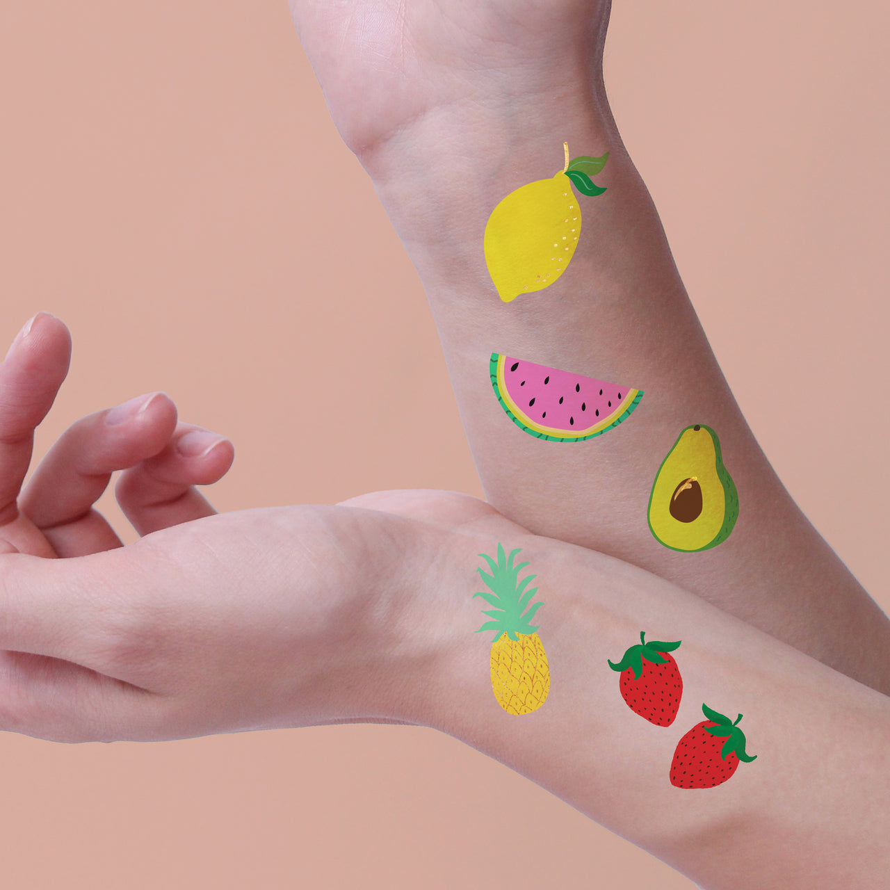 Shine bright in colorful fruit temporary tattoos from the Yummy Tummy Bundle featuring 25 assorted fruit tattoos: lemon, watermelon, avocado, pineapple and strawberries