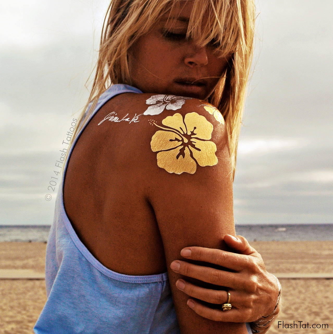 The tropical-inspired designs of the Flash Tattoos x Goldfish Kiss H2O collection look great when paired with your favorite bikini or sundress!